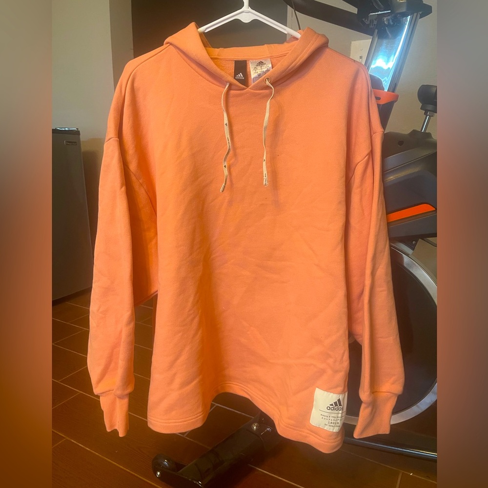 Small peach/orange Adidas sweater hoodie and matching sweatpants. Never worn.